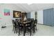 Elegant dining room with a large table, seating for eight, and a bright, airy feel with skylights at 13360 Foresman Blvd, Port Charlotte, FL 33981