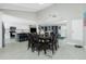Open concept dining room with seating for eight connects to the updated kitchen and living area at 13360 Foresman Blvd, Port Charlotte, FL 33981