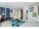 Bright and airy living room features tiled floors, stylish rug, and front door views at 13360 Foresman Blvd, Port Charlotte, FL 33981