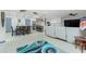 Open-concept living space features an open layout with updated kitchen and dining areas at 13360 Foresman Blvd, Port Charlotte, FL 33981