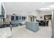 Open concept living space with kitchen, dining area, and living room with access to a skylight at 13360 Foresman Blvd, Port Charlotte, FL 33981