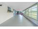 Spacious enclosed sunroom with a hammock, and floor-to-ceiling screened windows at 13360 Foresman Blvd, Port Charlotte, FL 33981