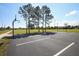 Community basketball court surrounded by green space, perfect for outdoor recreation at 13559 Martha Ave, Port Charlotte, FL 33981
