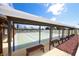 Covered shuffleboard courts with benches providing a shaded area for playing at 13559 Martha Ave, Port Charlotte, FL 33981