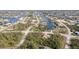 Panoramic aerial of a community highlighting the serene canal-front properties and neighborhood layout at 14795 San Domingo Blvd, Port Charlotte, FL 33981