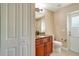 Well-lit bathroom features granite counters, tile floors, and white fixtures at 14795 San Domingo Blvd, Port Charlotte, FL 33981