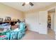 Bedroom has a ceiling fan and closet used for storage at 14795 San Domingo Blvd, Port Charlotte, FL 33981