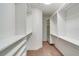 Walk-in closet with built-in shelves and rods, offering ample storage space at 14795 San Domingo Blvd, Port Charlotte, FL 33981