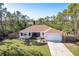 Charming single-story home with a well-manicured lawn, inviting entrance, and attached two car garage at 14795 San Domingo Blvd, Port Charlotte, FL 33981