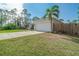 Charming single-story home with a two-car garage, framed by a well-maintained yard and privacy fence at 14795 San Domingo Blvd, Port Charlotte, FL 33981