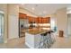 Well-lit kitchen featuring granite counters, stainless steel appliances and a convenient breakfast bar with seating at 14795 San Domingo Blvd, Port Charlotte, FL 33981