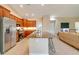 Kitchen with granite counters, stainless steel appliances, bar seating and open access to the main living space at 14795 San Domingo Blvd, Port Charlotte, FL 33981