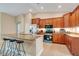 Modern kitchen with stainless steel appliances, granite countertops, and breakfast bar with counter seating at 14795 San Domingo Blvd, Port Charlotte, FL 33981