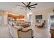 Spacious living room showcasing an open concept layout with kitchen access and comfortable seating area at 14795 San Domingo Blvd, Port Charlotte, FL 33981