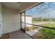 View from the screened porch with a view of the landscaped yard and neighborhood street at 14795 San Domingo Blvd, Port Charlotte, FL 33981
