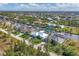 Gorgeous aerial view of waterfront homes, canals, boat docks and lush landscaping in a neighborhood at 15776 Melport Cir, Port Charlotte, FL 33981