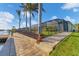Home's fenced backyard, seawall, and boat dock along the canal at 15776 Melport Cir, Port Charlotte, FL 33981
