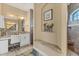 Elegant bathroom featuring a vanity area, granite countertop, tile shower, and a well-lit, inviting atmosphere at 15776 Melport Cir, Port Charlotte, FL 33981
