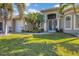 Beautiful single Gathering home with a well-manicured lawn, mature trees and a three-car garage at 15776 Melport Cir, Port Charlotte, FL 33981