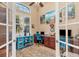Bright office space with ample natural light, complemented by built-in desk and storage solutions at 15776 Melport Cir, Port Charlotte, FL 33981