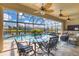 Inviting screened-in lanai featuring a sparkling pool, comfortable seating, and a lovely waterfront view at 15776 Melport Cir, Port Charlotte, FL 33981