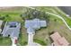 A sprawling property with a well-maintained lawn, pool, and picturesque surroundings at 18 Pebble Beach Road, Rotonda West, FL 33947