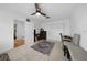 Bedroom featuring neutral tile floors, desk, chair, ceiling fan and closet at 18 Pebble Beach Road, Rotonda West, FL 33947