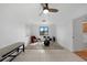 Bonus room with tile floors, ceiling fan, drum set, and access to bathroom at 18 Pebble Beach Road, Rotonda West, FL 33947
