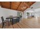 Elegant dining area with an exposed beam ceiling and open floor plan at 18 Pebble Beach Road, Rotonda West, FL 33947