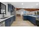 Modern kitchen showcasing stainless steel appliances and light-colored floors and countertops at 18 Pebble Beach Road, Rotonda West, FL 33947