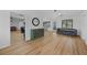 Bright living room with hardwood floors and ample natural light from the windows and french doors at 18 Pebble Beach Road, Rotonda West, FL 33947