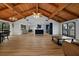 Expansive living space with wood floors, exposed beam ceiling, and natural light at 18 Pebble Beach Road, Rotonda West, FL 33947
