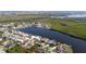 Aerial view of waterfront homes, highlighting proximity to the canal and coastline at 18970 Mcgrath Cir, Port Charlotte, FL 33948