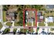 Aerial view of home featuring fenced in back yard with pool and adjacent canal at 18970 Mcgrath Cir, Port Charlotte, FL 33948
