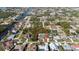 Aerial view of home featuring fenced in back yard with pool and adjacent canal at 18970 Mcgrath Cir, Port Charlotte, FL 33948
