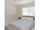Cozy bedroom featuring a comfortable bed, soft bedding, and a neutral color scheme at 18970 Mcgrath Cir, Port Charlotte, FL 33948