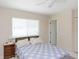 Charming bedroom with a bright window, classic wooden furniture, and relaxing decor at 18970 Mcgrath Cir, Port Charlotte, FL 33948