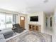 Inviting living room featuring neutral tones, comfortable seating, and a stylish area rug at 18970 Mcgrath Cir, Port Charlotte, FL 33948