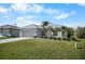 Single Gathering home with a two-car garage and well-maintained lawn at 194 Sunset Rd, Rotonda West, FL 33947