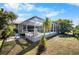 Exterior view of the lanai with a sparkling pool and screened in outdoor space at 194 Sunset Rd, Rotonda West, FL 33947