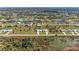 Bird's eye view of a well-planned community featuring homes alongside canals and lush landscaping at 237 W Pine Valley Ln, Rotonda West, FL 33947