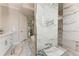 Spacious bathroom with marble accents, a soaking tub, and a well-lit vanity at 237 W Pine Valley Ln, Rotonda West, FL 33947