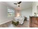 Comfortable bedroom features a soft bed, dresser, and a ceiling fan providing a relaxing retreat at 237 W Pine Valley Ln, Rotonda West, FL 33947