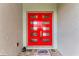 Inviting red double door with glass panels, complemented by a 'Welcome' doormat at 237 W Pine Valley Ln, Rotonda West, FL 33947
