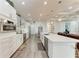 Spacious kitchen featuring an island with seating, stainless steel appliances, and ample cabinet space at 237 W Pine Valley Ln, Rotonda West, FL 33947