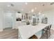 Gourmet kitchen featuring a large center island, quartz countertops and stainless steel appliances at 237 W Pine Valley Ln, Rotonda West, FL 33947