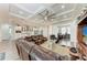 Open floor plan living room with tray ceiling connects to the kitchen and dining area at 237 W Pine Valley Ln, Rotonda West, FL 33947