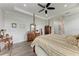 Elegant main bedroom boasts a four-poster bed, tray ceiling, and tasteful decor at 237 W Pine Valley Ln, Rotonda West, FL 33947