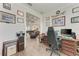 Office space with a view into the living room, traditional desk, and comfortable ergonomic chair at 237 W Pine Valley Ln, Rotonda West, FL 33947
