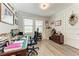 Office space with a traditional wooden desk, comfortable chair, and natural light from the window at 237 W Pine Valley Ln, Rotonda West, FL 33947